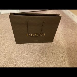 Authentic Gucci empty paper bag.  15x11